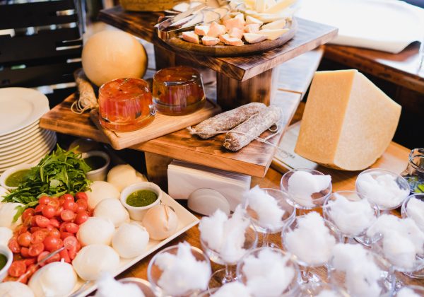 Catering banquet table at reception. Cheese delicatessen. Restaurant presentation, molecular gastronomy, haute cuisine, food consumption, party, food for wine concept.